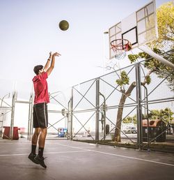 Young man playing basketball training