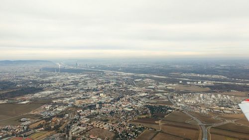 High angle view of buildings in city against sky