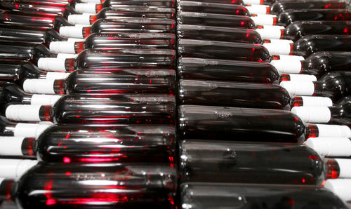 Full frame shot of wine bottles in store