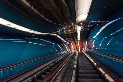 High angle view of illuminated railroad tracks at night