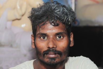 Portrait of a worker in an idol making shop