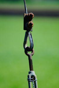 Close-up of chain hanging on rope