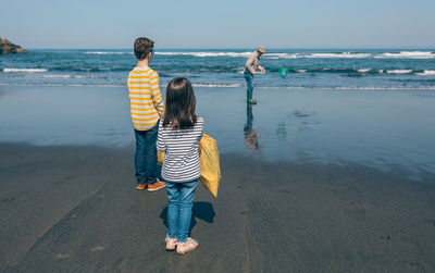 Rear view of women on beach