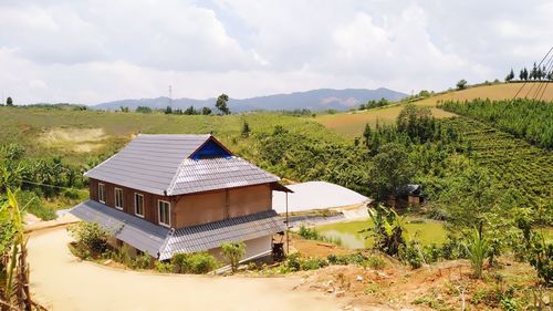 House on field against sky