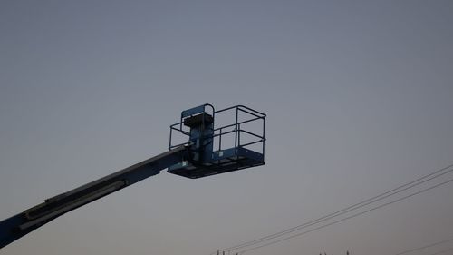 Low angle view of windmill against clear sky