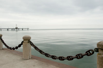 Pier over sea against sky