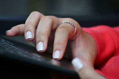 Close-up of woman using laptop 