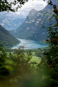 Scenic view of lake and mountains against sky