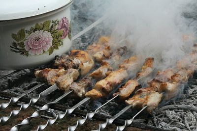 Close-up of meat on barbecue grill