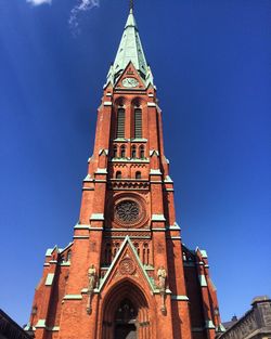 Low angle view of building against blue sky