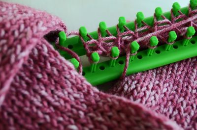 Close-up of wool on knifty knitter