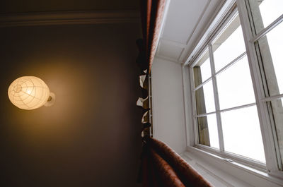 Light bulbs hanging from ceiling of house