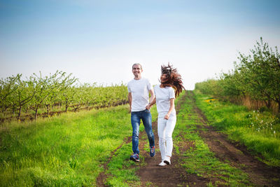 Full length of a woman standing on field