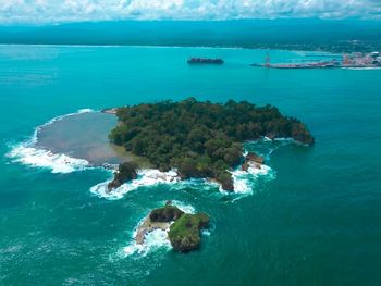 High angle view of people swimming in sea