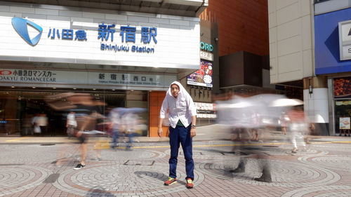 Woman standing in front of building