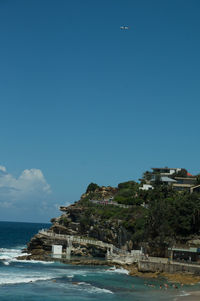 Scenic view of sea against clear blue sky