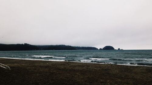 View of calm beach against sky