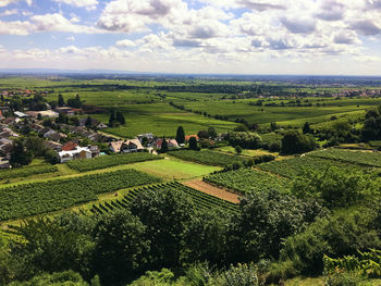 High angle view of field against cloudy sky