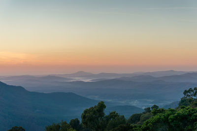 Scenic view of mountains against sky during sunset