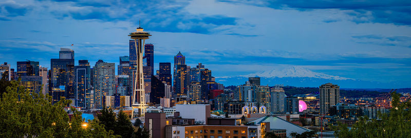 Illuminated cityscape against sky