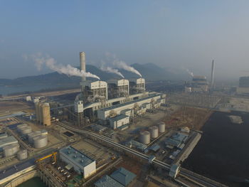 High angle view of factory against sky