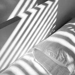 High angle view of shadow on bed at home