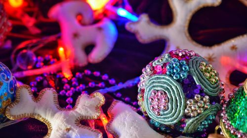 Close-up of various colorful christmas ornaments for sale at market