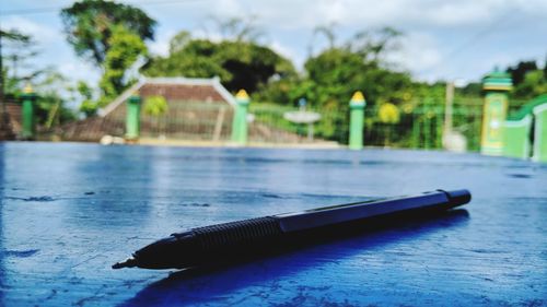 Close-up of swimming pool against trees