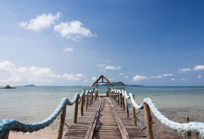 Pier over sea against sky