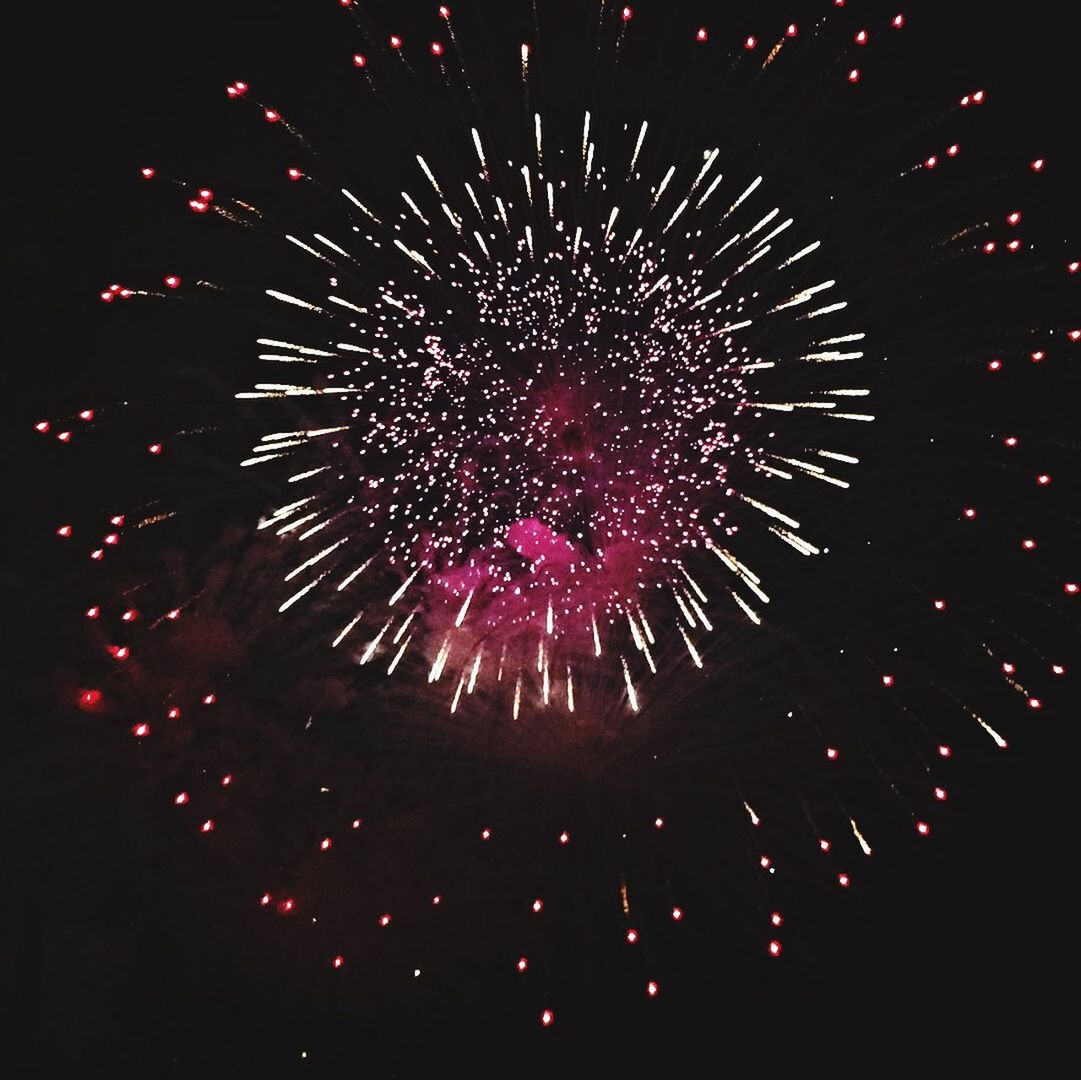 night, illuminated, celebration, firework display, glowing, exploding, firework - man made object, long exposure, arts culture and entertainment, event, motion, low angle view, celebration event, sparks, entertainment, firework, fire - natural phenomenon, blurred motion, multi colored, sky