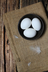 High angle view of eggs in container on table