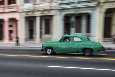 Vintage car on road in city