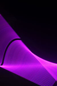 Low angle view of light trails at night