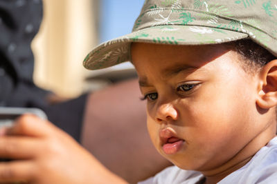 Close-up portrait of boy looking away
