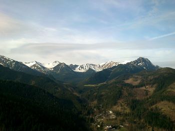 Scenic view of snowcapped mountains against sky