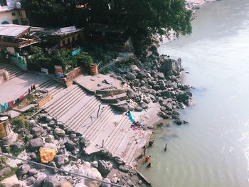 High angle view of plants by river in city
