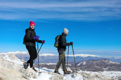 Two hikers walk