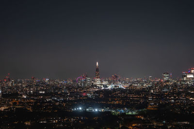 Illuminated buildings in city at night