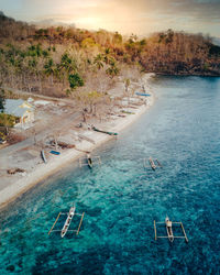 High angle view of swimming pool by sea against sky