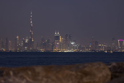 Illuminated buildings in city at night