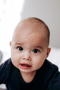 Portrait of sweet funny baby with chubby cheeks