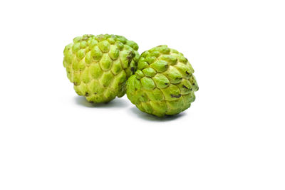 Close-up of fruits against white background