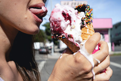 Midsection of person holding ice cream