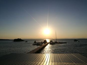 Scenic view of sea against clear sky during sunset