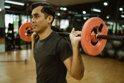 Young woman exercising in gym