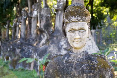 Buddha statue against trees