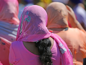 Rear view of women with dupatta on head