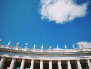 Low angle view of sculpture against cloudy sky