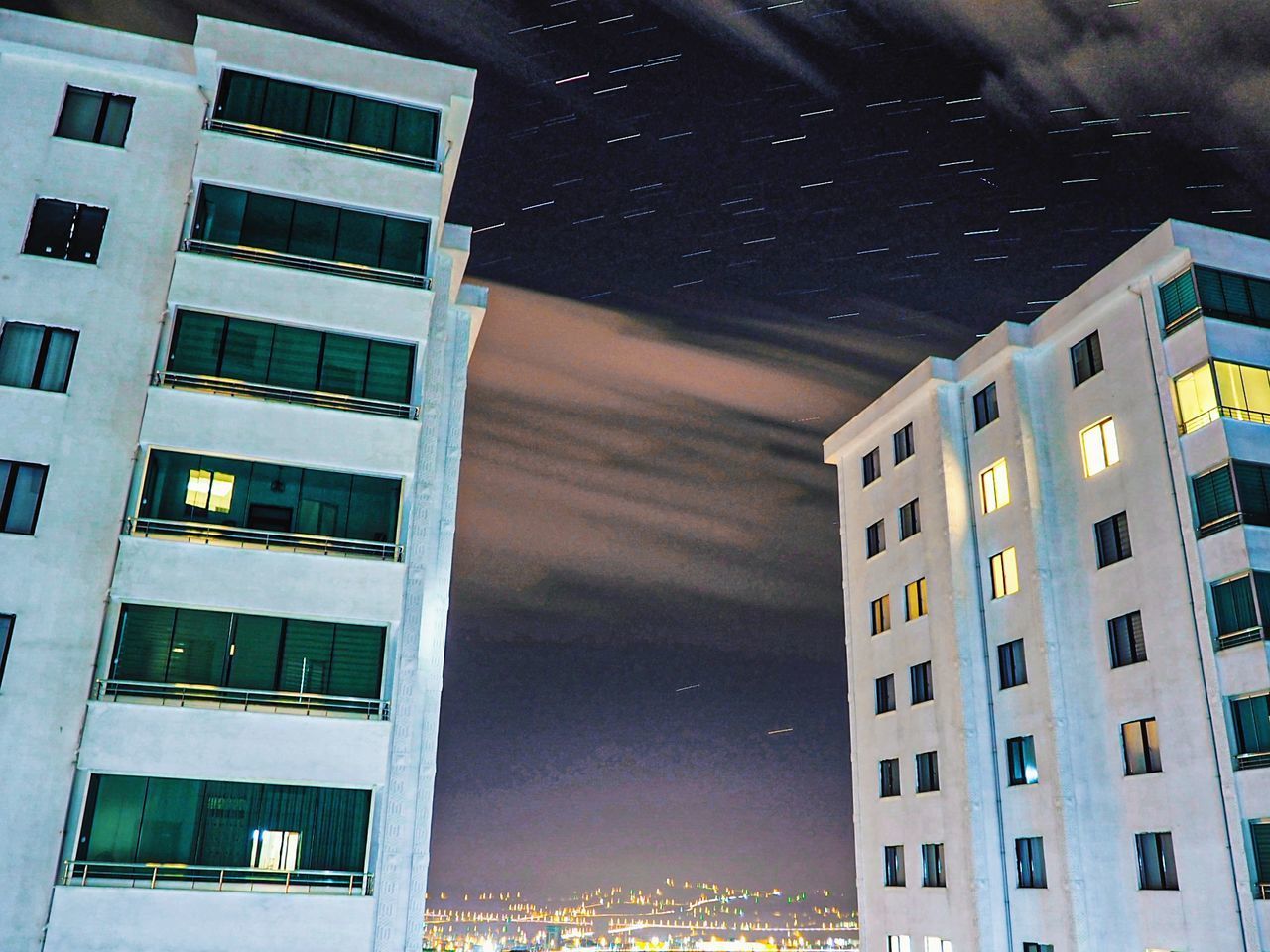 LOW ANGLE VIEW OF BUILDING AT NIGHT