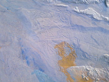 Shot of sand covered by clear water on the river 